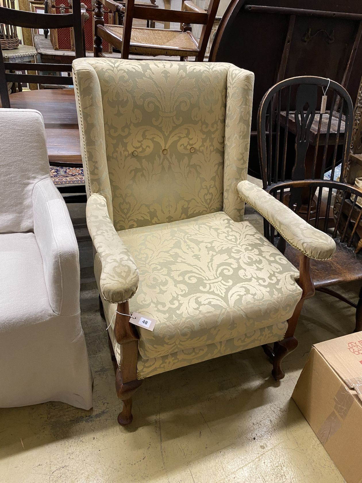 An 18th century style upholstered mahogany armchair, width 74cm, depth 65cm, height 106cm